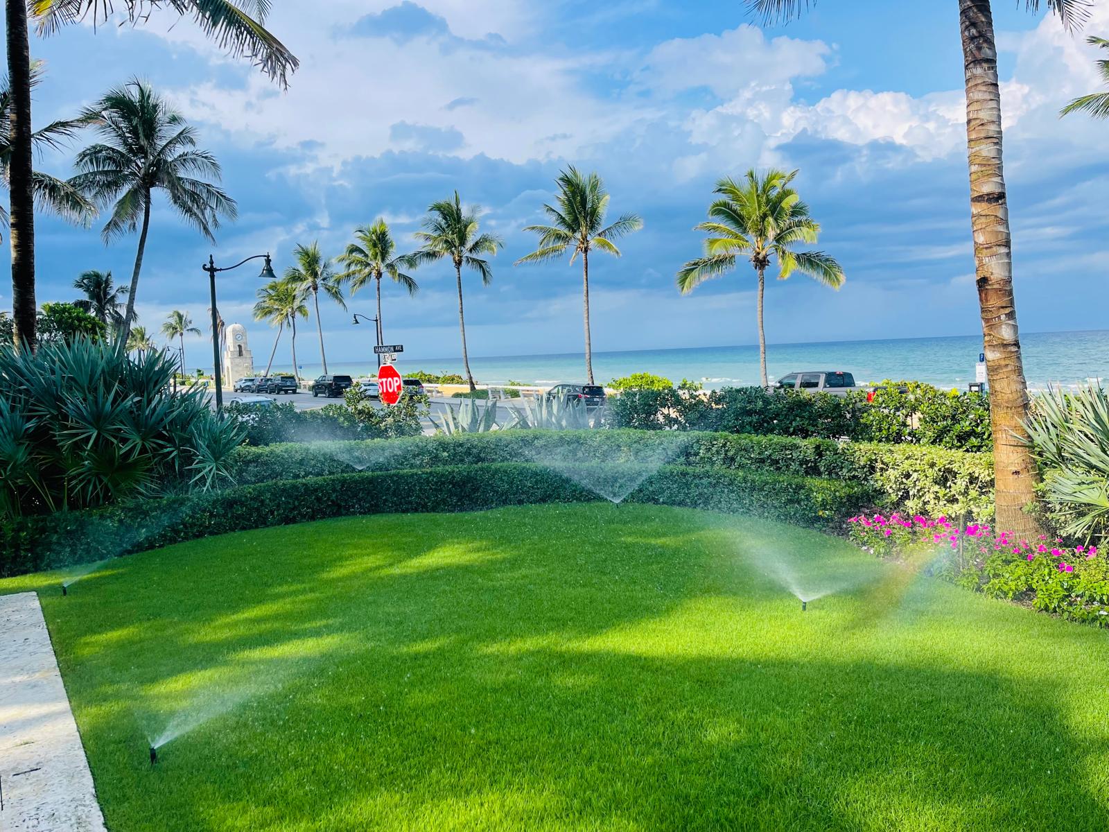 Greenscaper irrigation system watering a landscaped lawn near the Florida coast